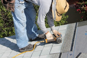 Home Roof Construction Site. Removal of old roof and replacement