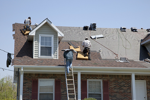 roofers-working-on-house