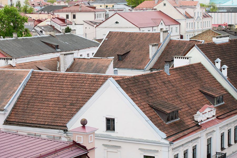 Residential roofs with stains.