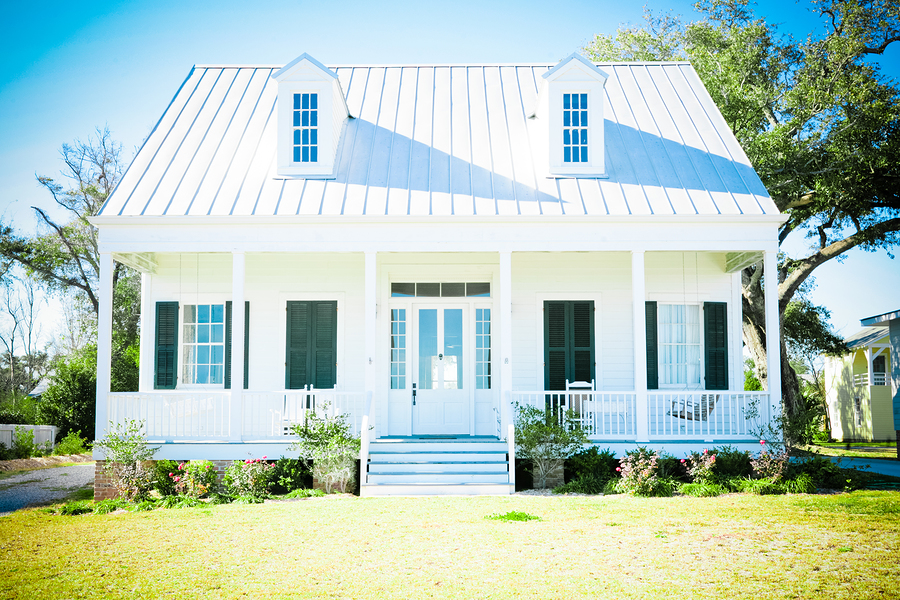 Nice white house with metal roof.