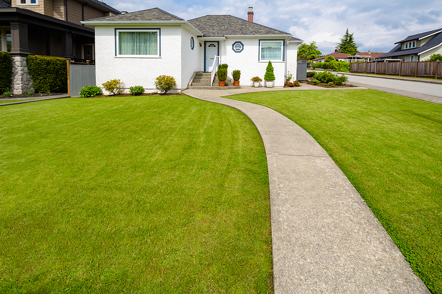 Exterior of a well-maintained house with a new roof.