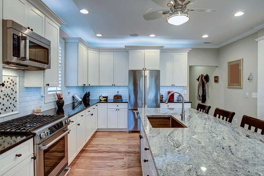 Nice kitchen recently remodeled with addition of large quartz island with bar stools for extra seating.