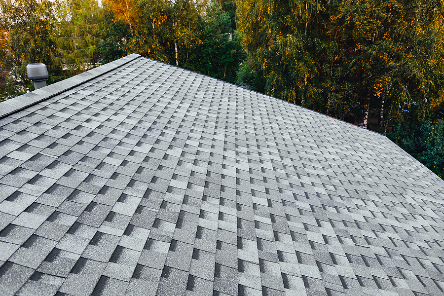 Family Home renovated roof or new roof with asphalt shingles.