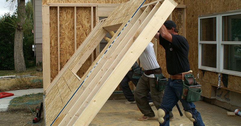 home improvement contractor putting up a wall in Dundee, MI