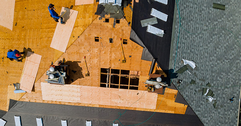 roofing company working on a roof in Swanton, Ohio