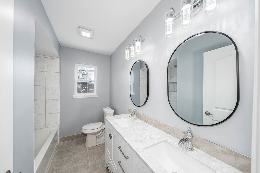 Modern bathroom with grey walls and white furnishing