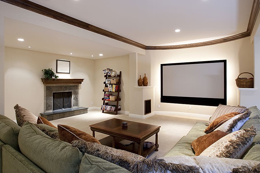 Finished basement with stone fireplace and theater system. 