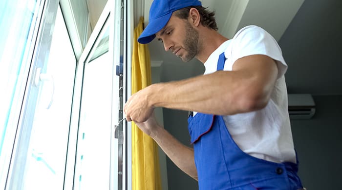 Man installing window