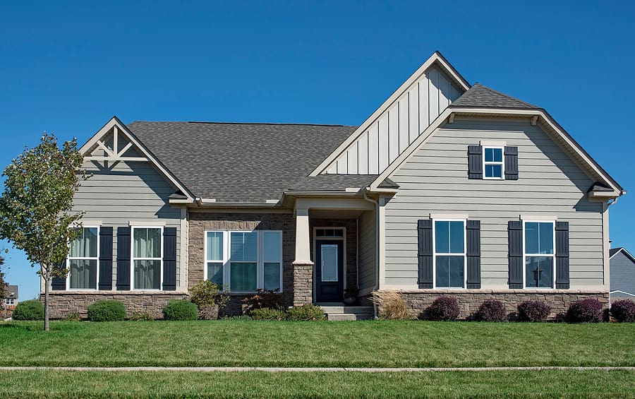 One story home with new gray siding. 