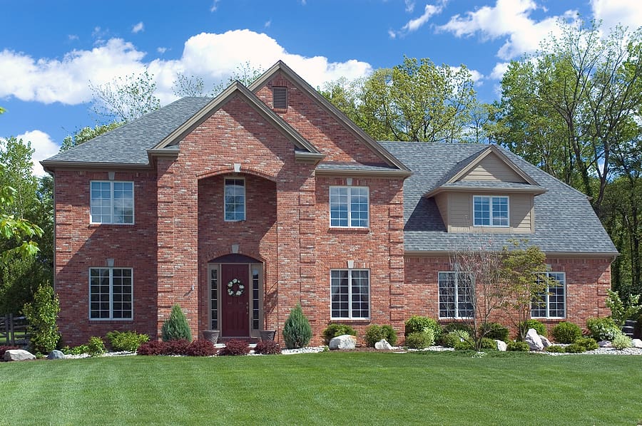 Large modern brick home with a new roof. 